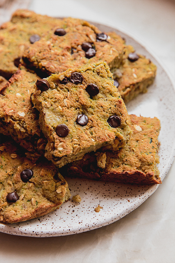 Zucchini banana breakfast bars on a plate.