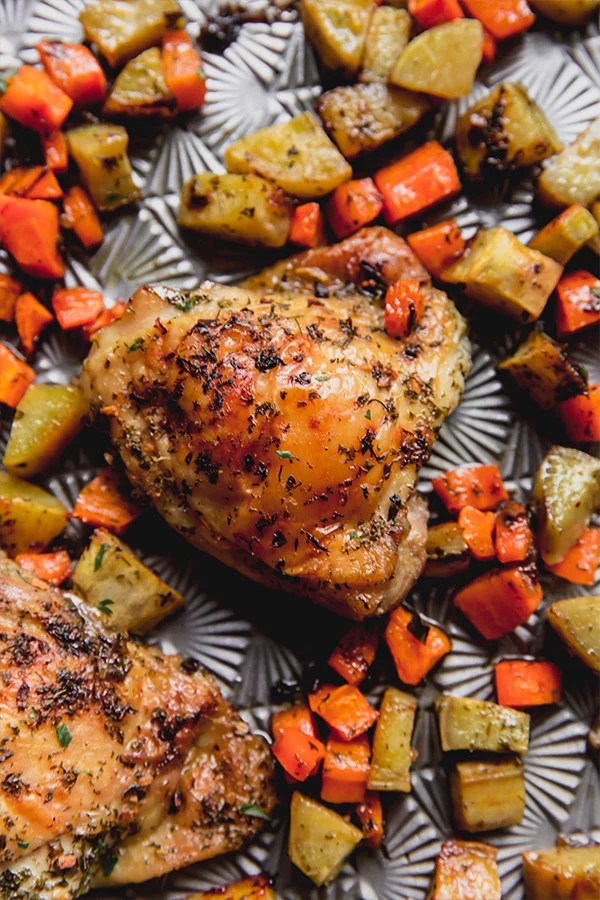 Sheet pan dinner of ranch chicken and vegetables.