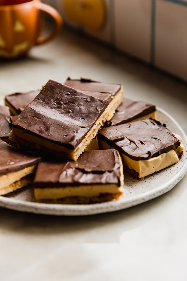 A plate of pumpkin spice s'mores bars ready to be eaten!