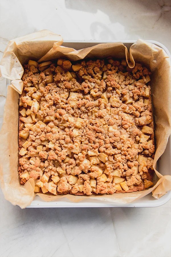 Apple pie bars in a baking pan.