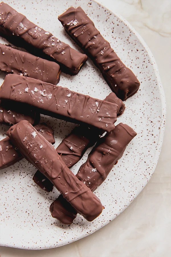 Gluten-free Kit Kat bars piled on a plate.