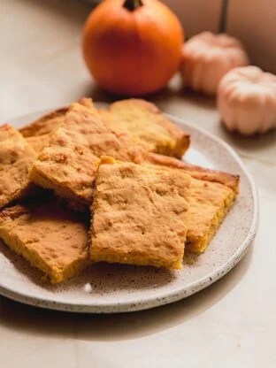 Plate stacked with "corn" bread.