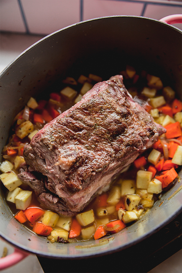 The apple cider braised pot roast before baking.
