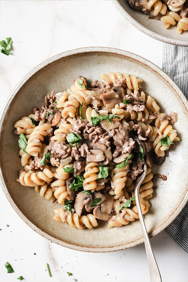Hamburger stroganoff on a plate with a fork.