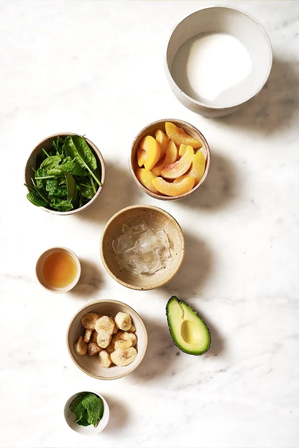 Ingredients including peaches, spinach, and avocado.