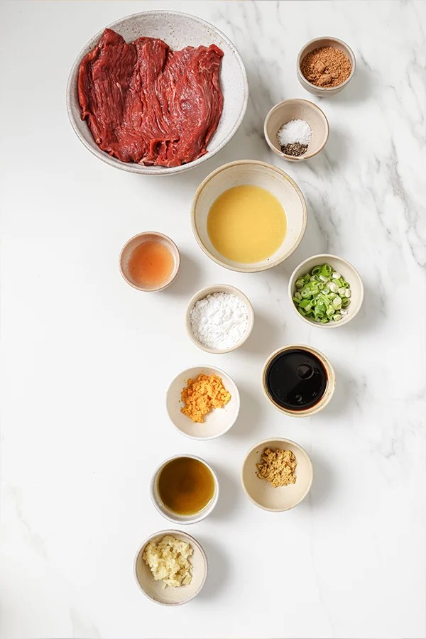 Orange beef ingredients in separate bowls.