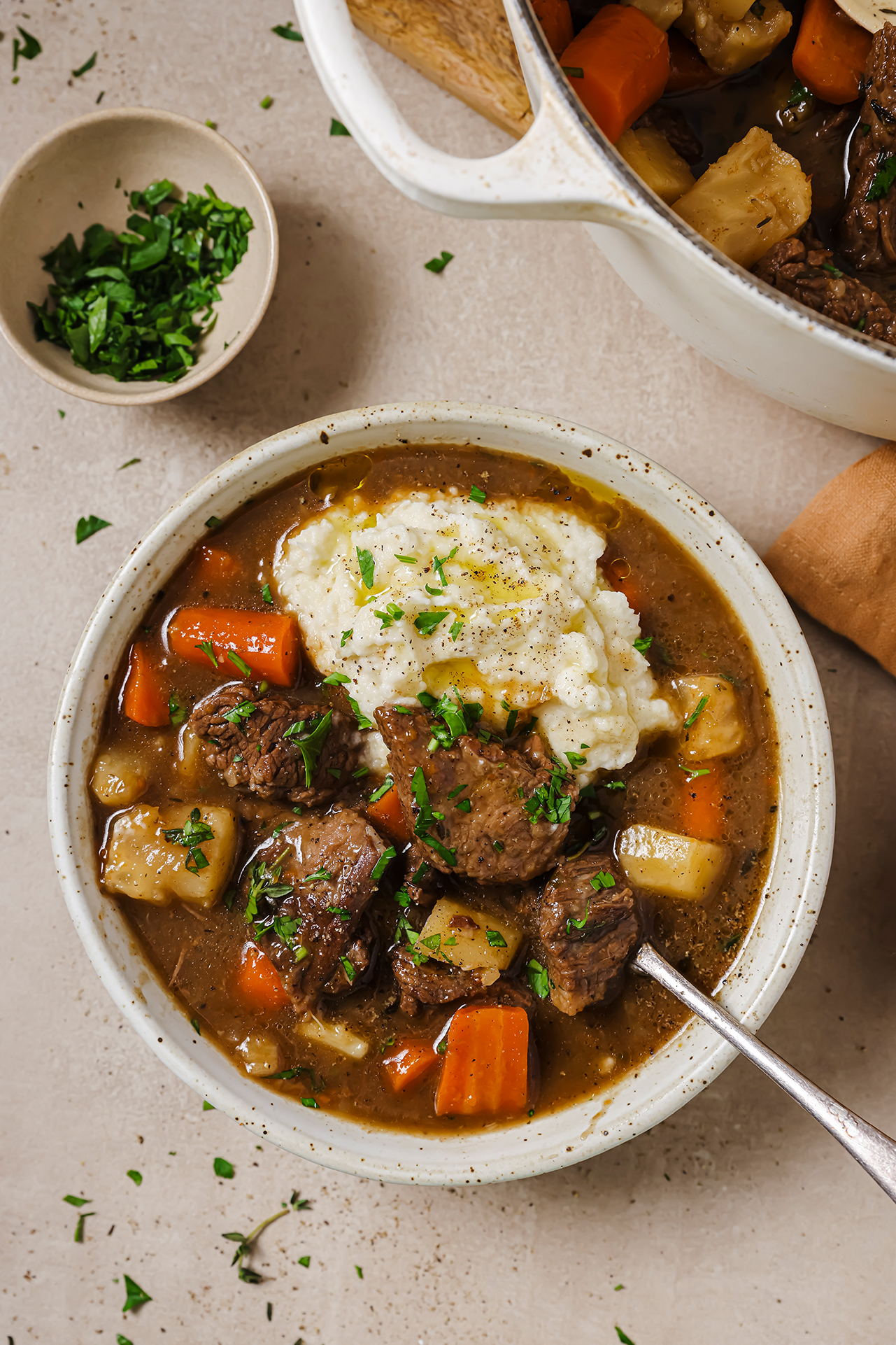 Dutch oven beef stew served with mashed potatoes.