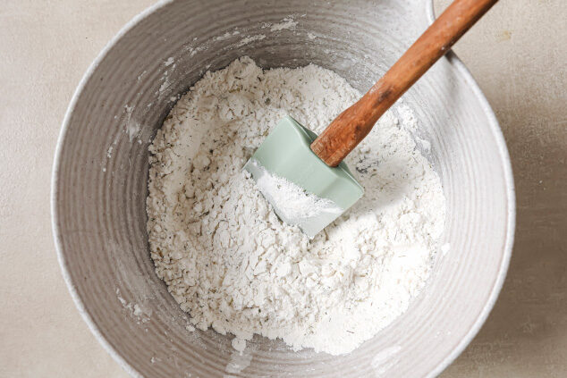 Dry ingredients in a bowl with a spatula
