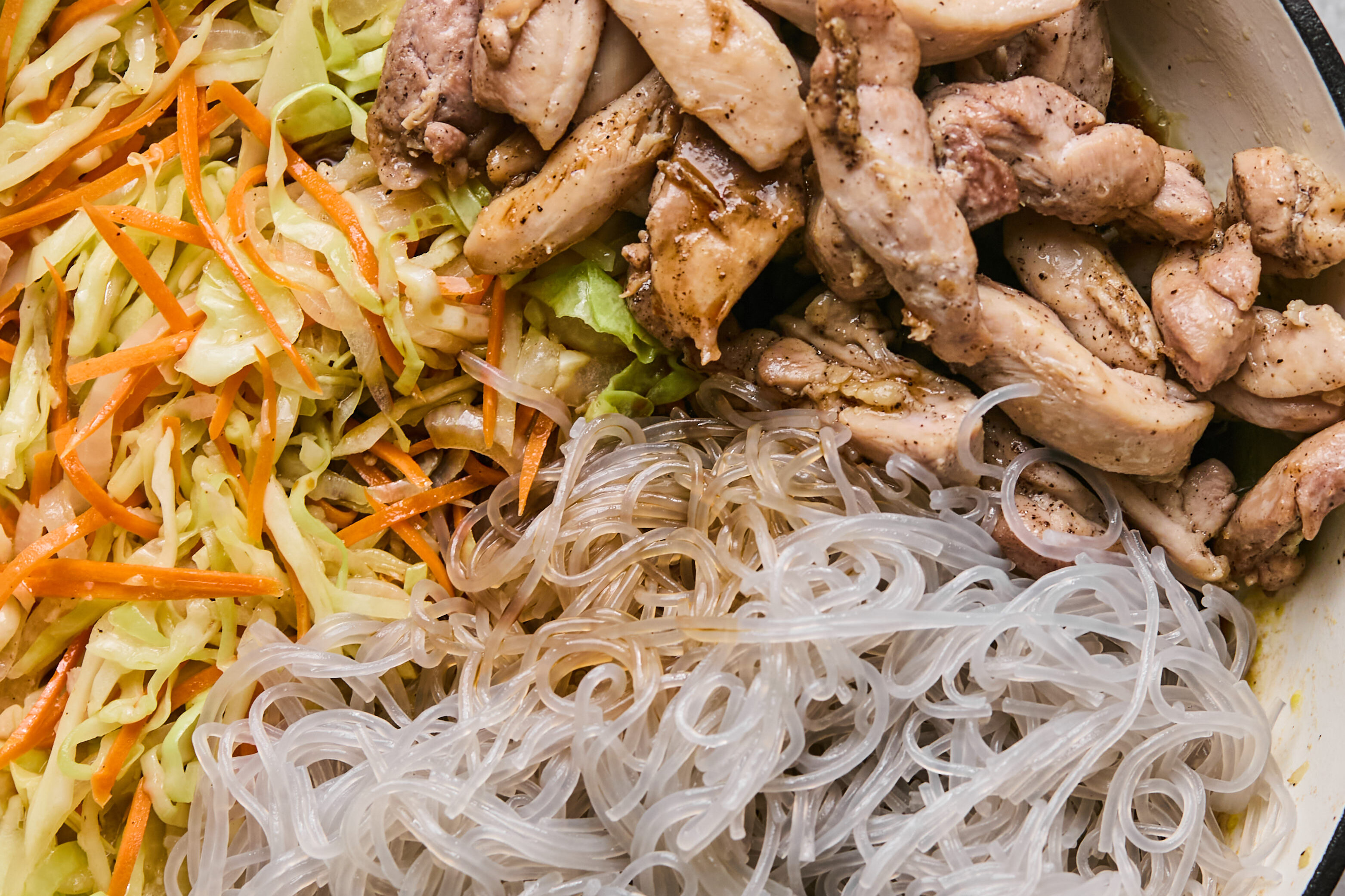 Chicken, vegetables, and noodles unmixed with sauce.
