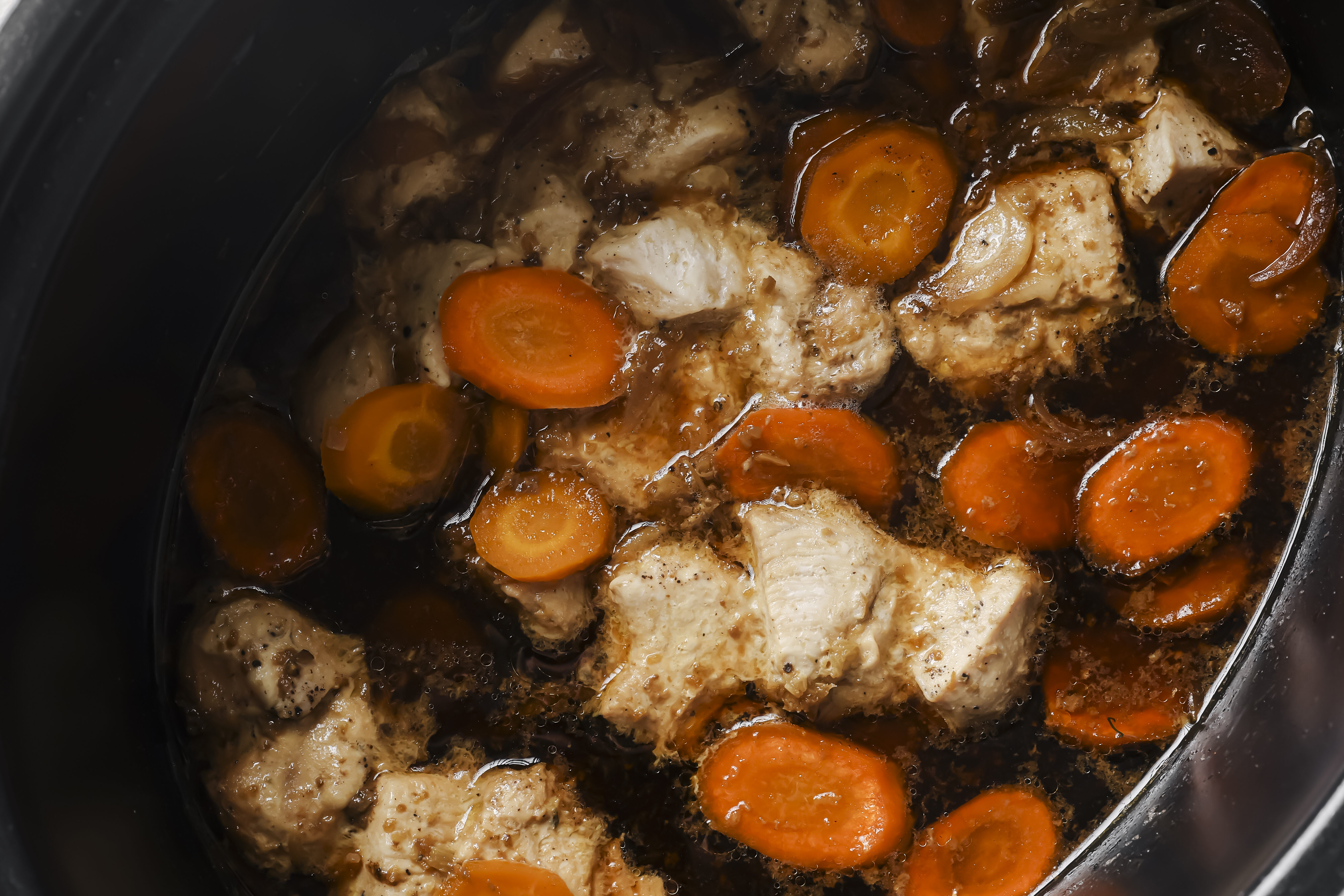 Chicken and broccoli cooked in a slow cooker with the sauce.