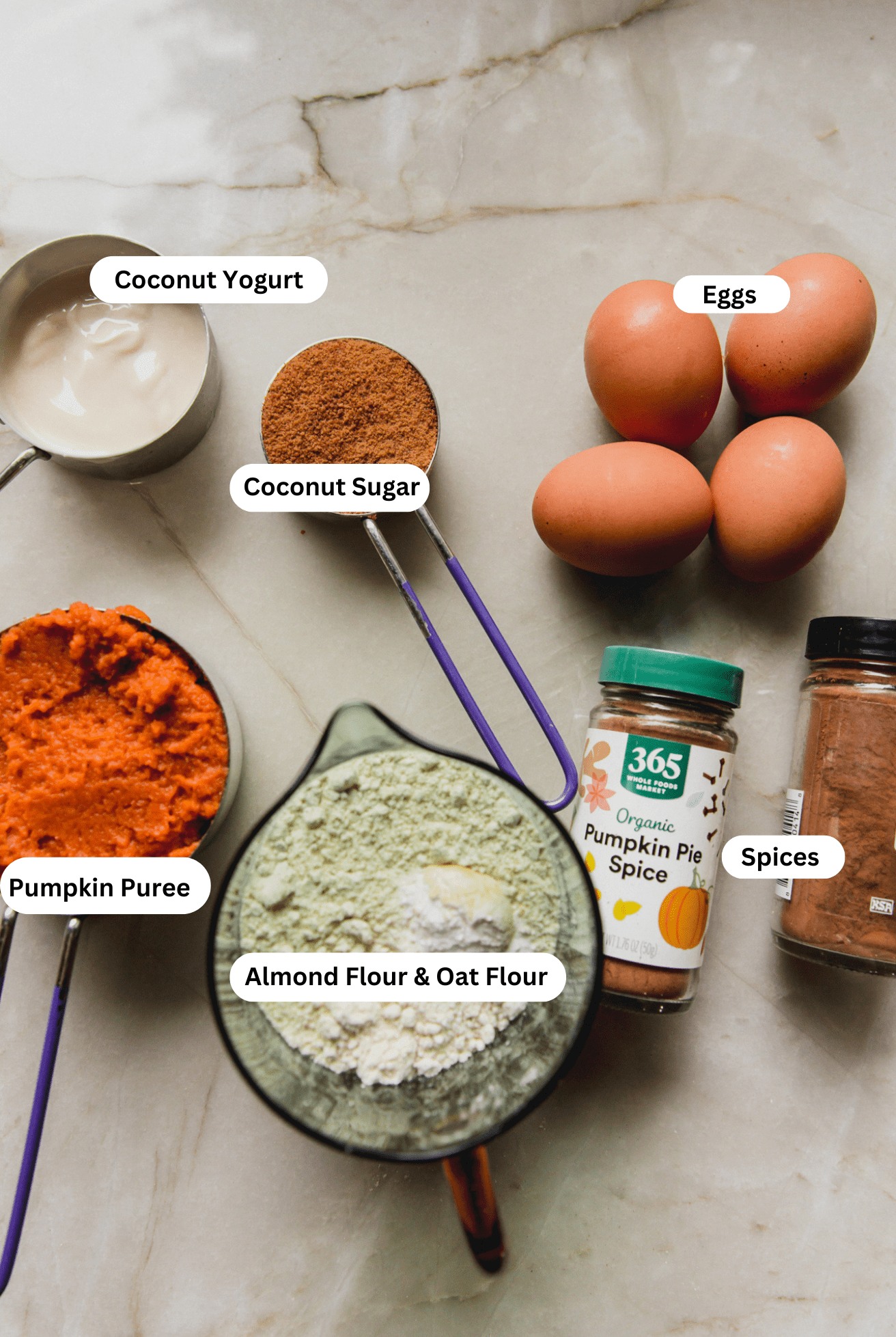 All the ingredients needed to make the almond flour pumpkin loaf set out before baking begins.