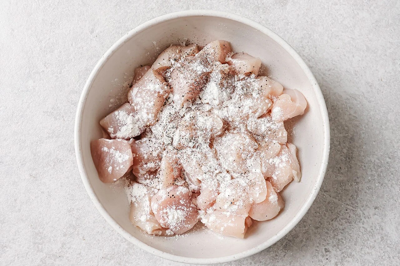 Cubed chicken breast tossed with salt, pepper and arrowroot starch.