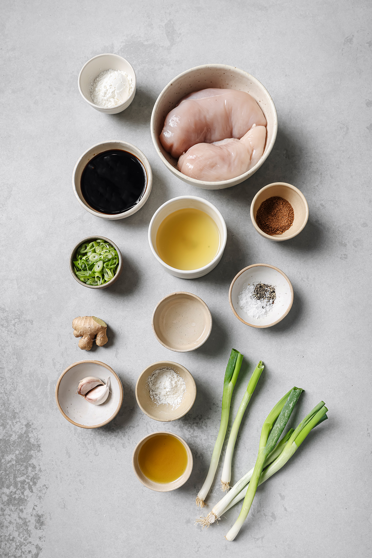 Mongolian chicken ingredients in bowls.