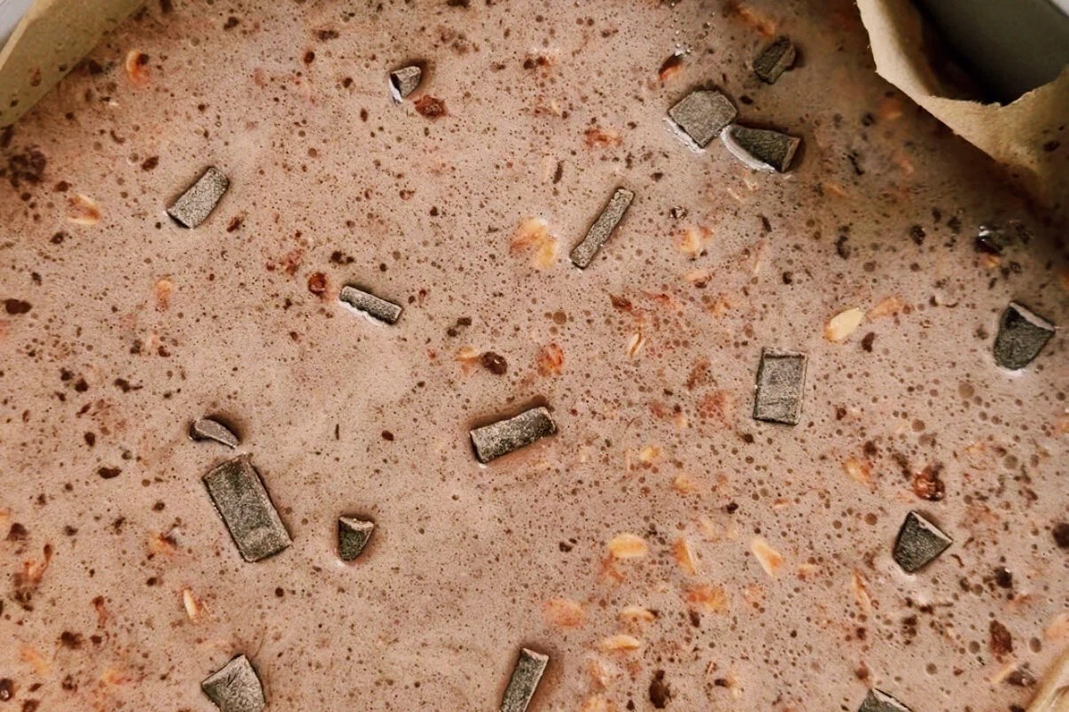 The baked oat mixture in a baking dish before baking.