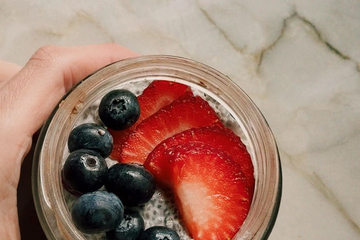 The final protein oatmeal breakfast cups topped with chia seed pudding and berries.