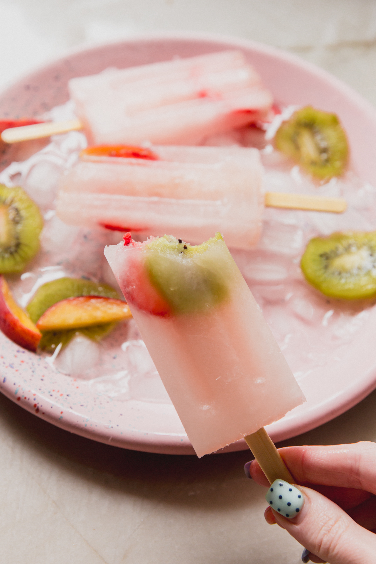A popsicle after being frozen with a bite taken out of it.