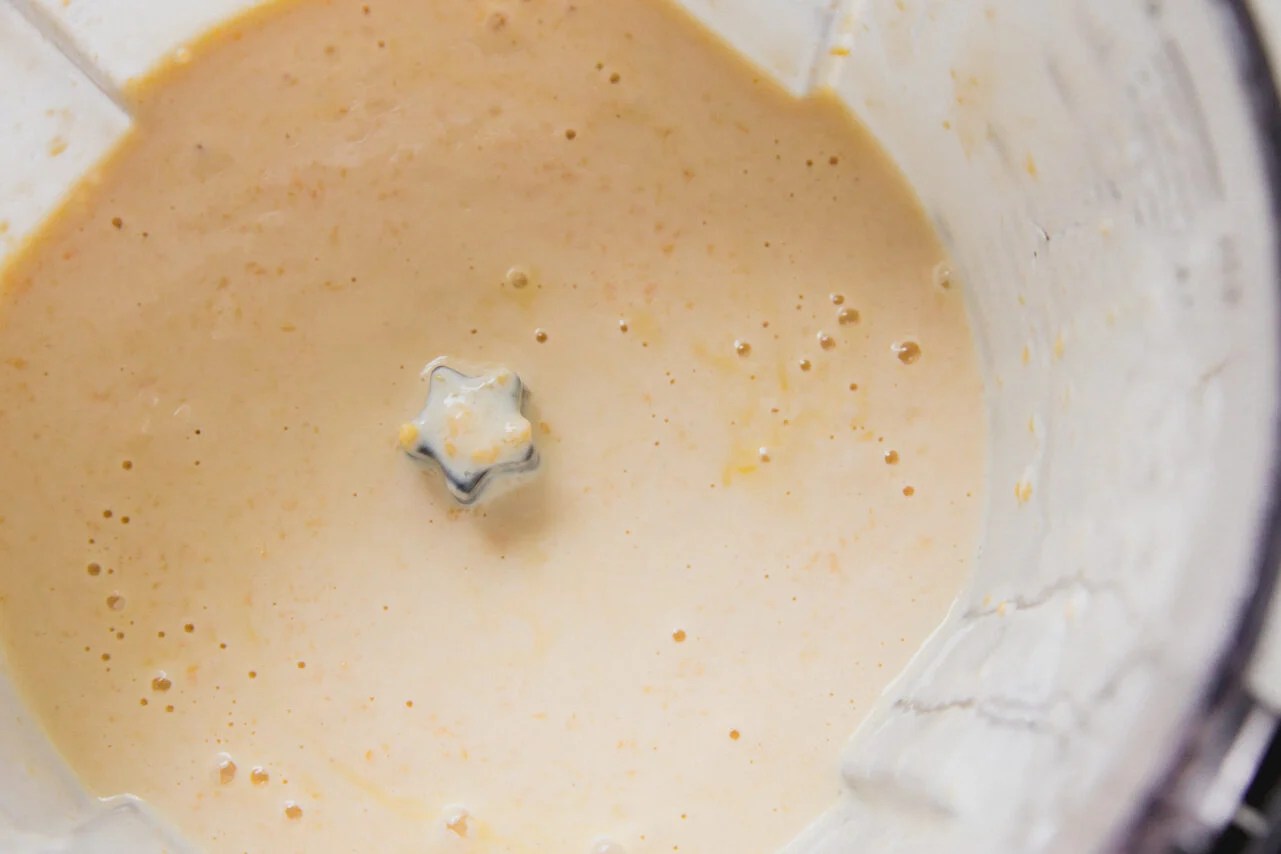 Mango chia pudding ingredients blended in a food processor