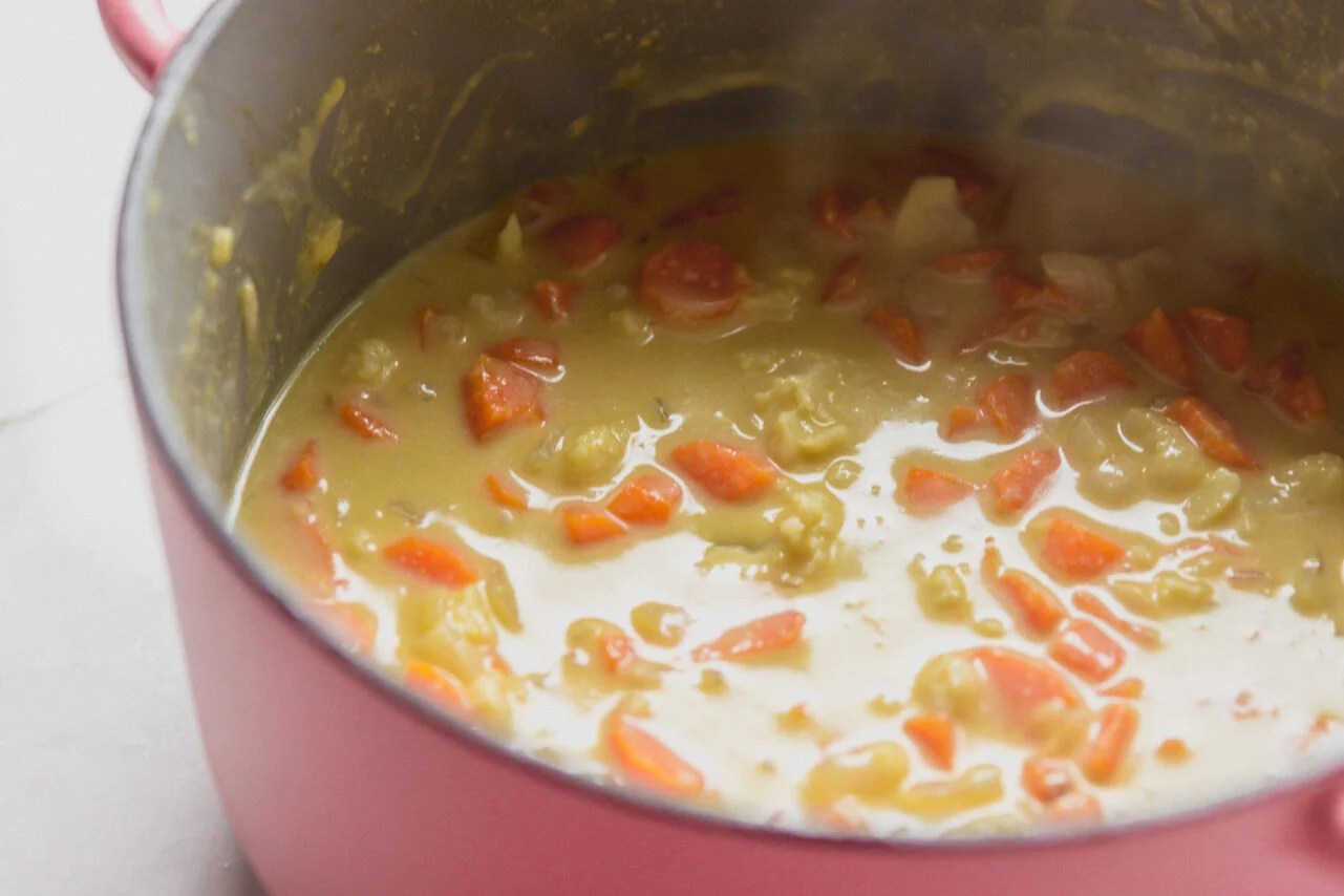 Dairy free cheese sauce, unblended in a pot.