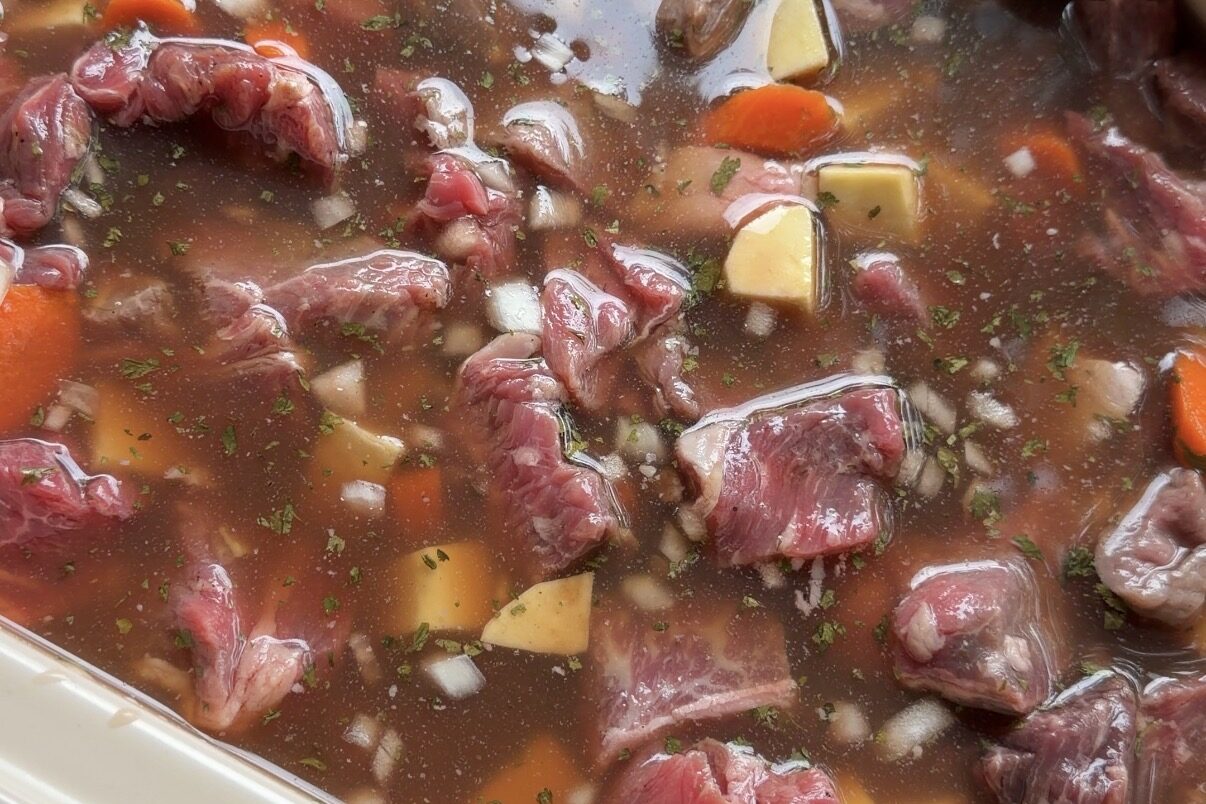 Slow cooker beef stew uncooked in the crockpot