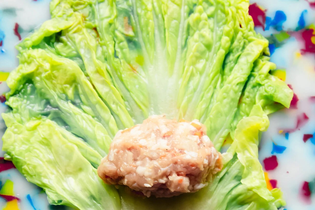 Cabbage leaf with dumpling filling in the center