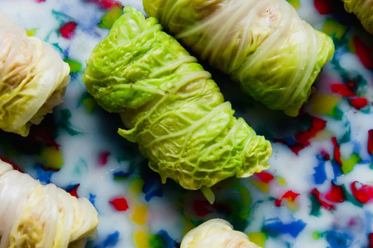 Uncooked cabbage dumplings on a cutting board