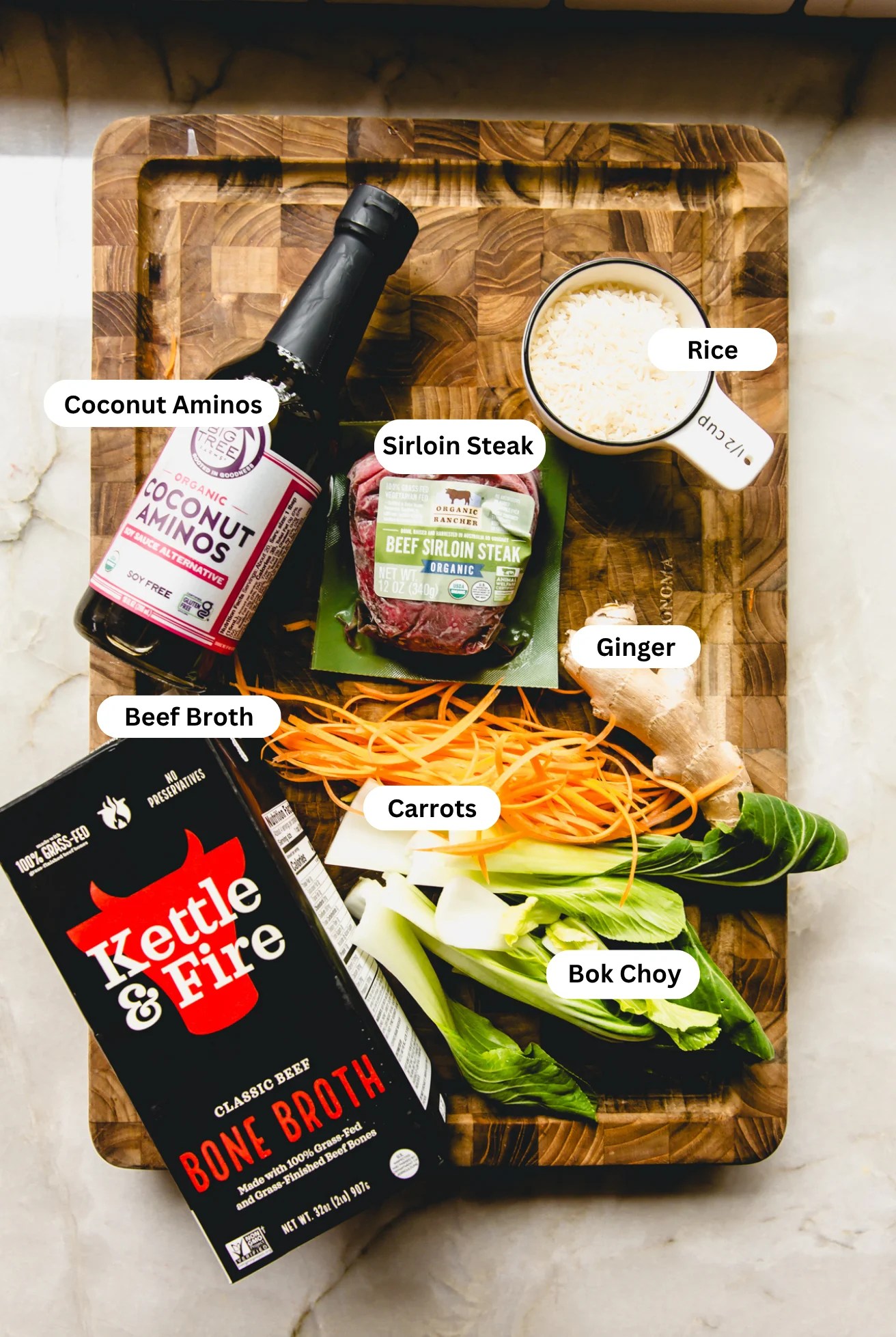 All the ingredients needed to make brothy steak and rice bowls laid out on the counter.
