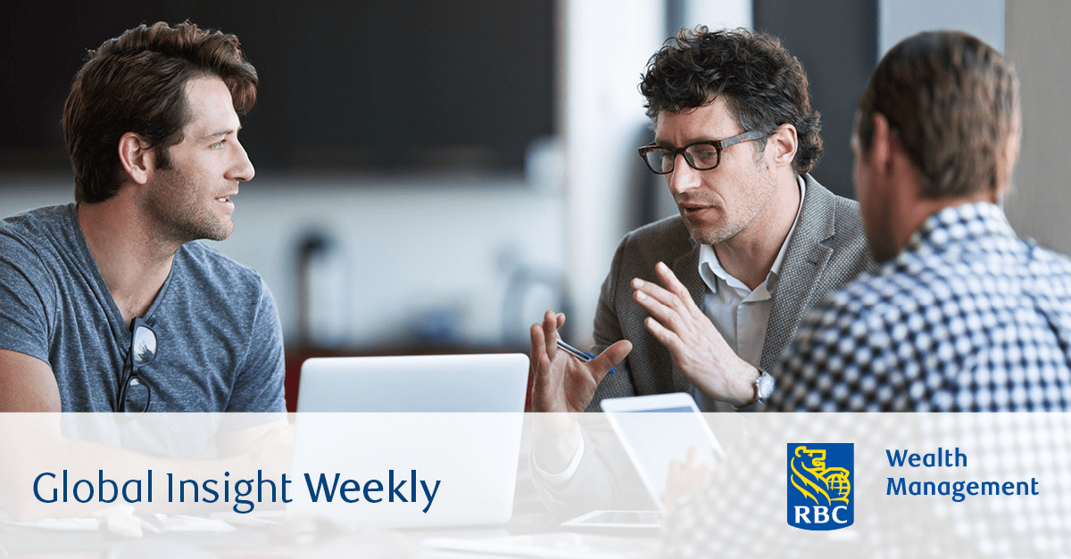 A group of people talking at a table