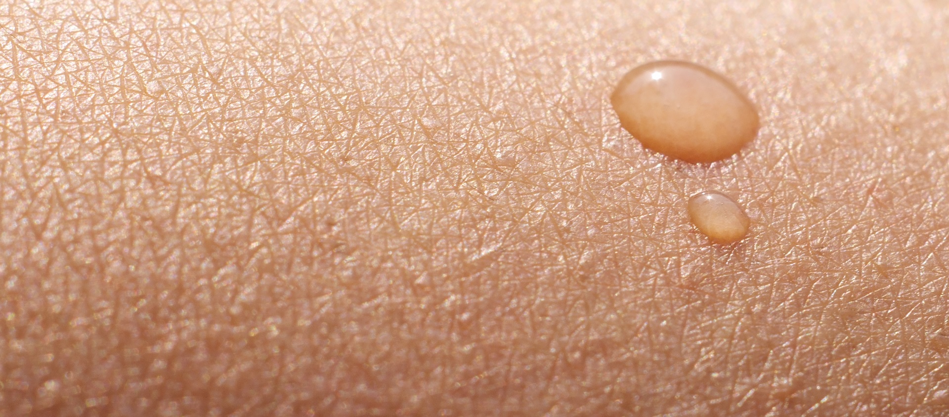 Water drop on human skin