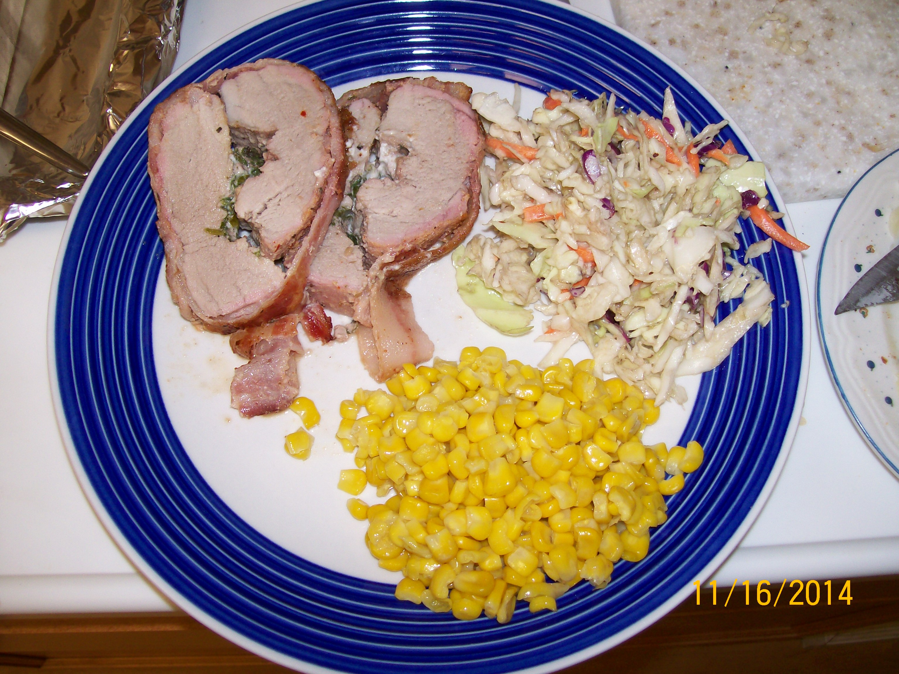 First pork tenderloin stuffed with spinach,3 cheeses and bacon lattice