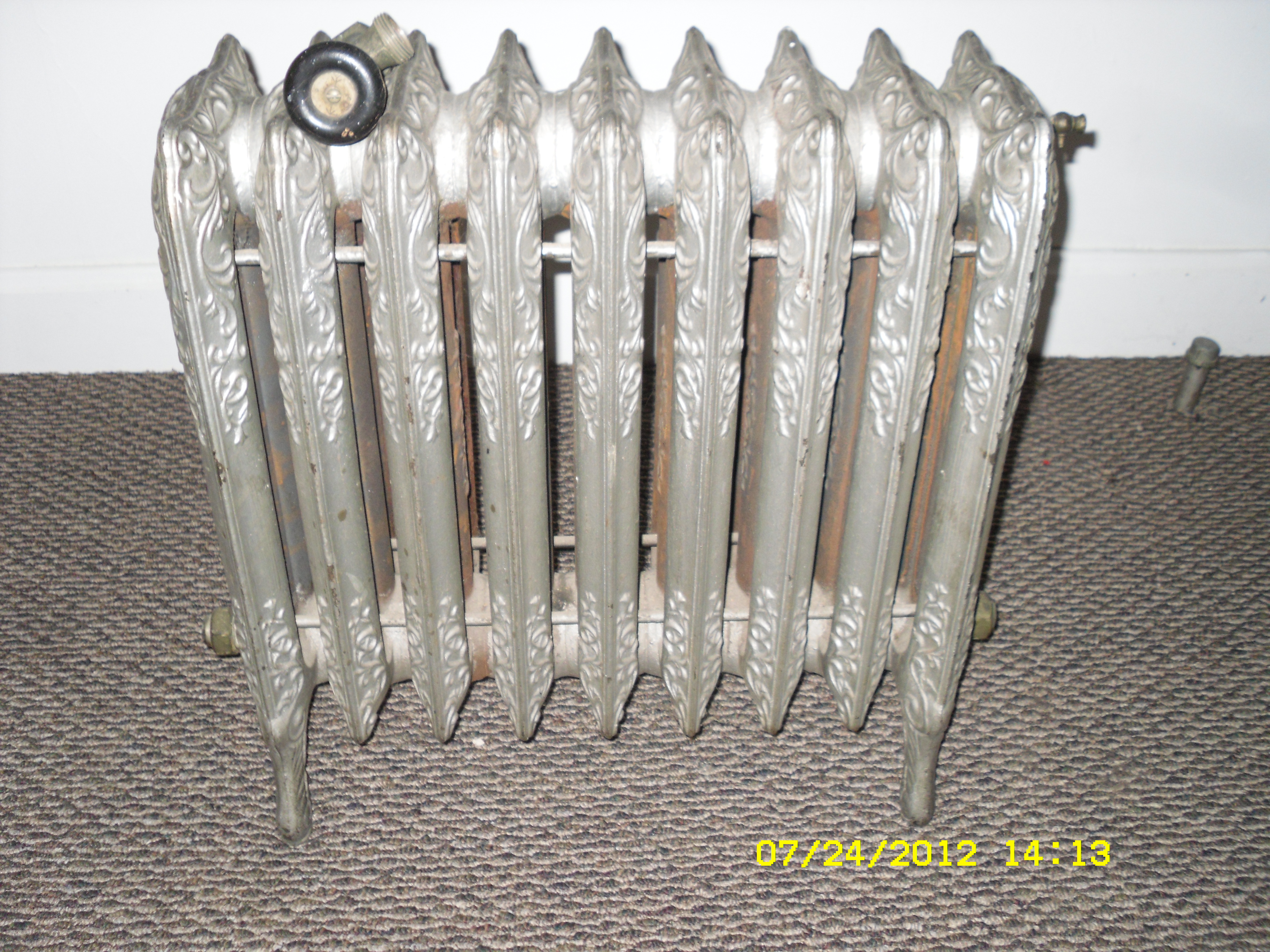 Several old radiator heaters — Heating Help The Wall