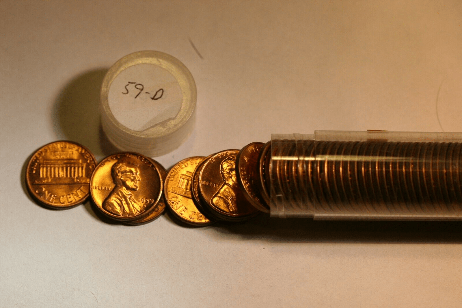Strike through error; 1959 d. Penny obverse. — Collectors Universe