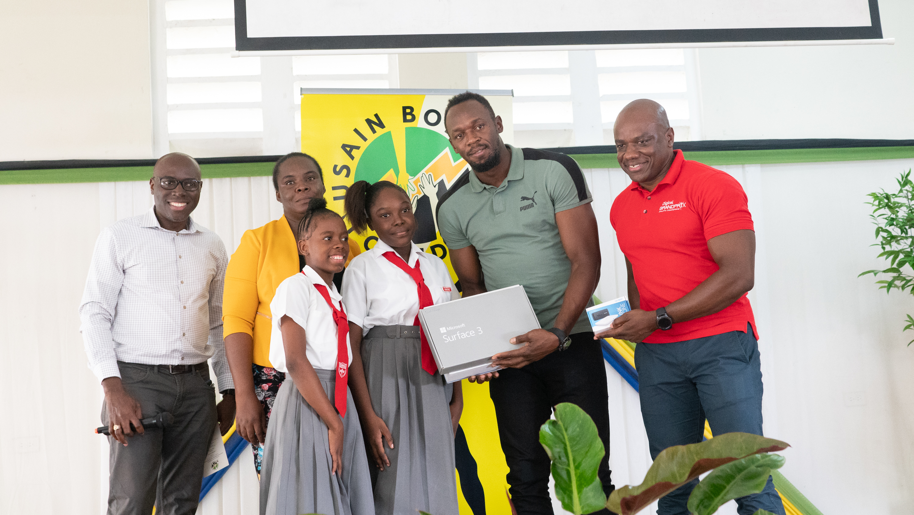 Usain Bolt Foundation refurbishes school ground and hands over computer