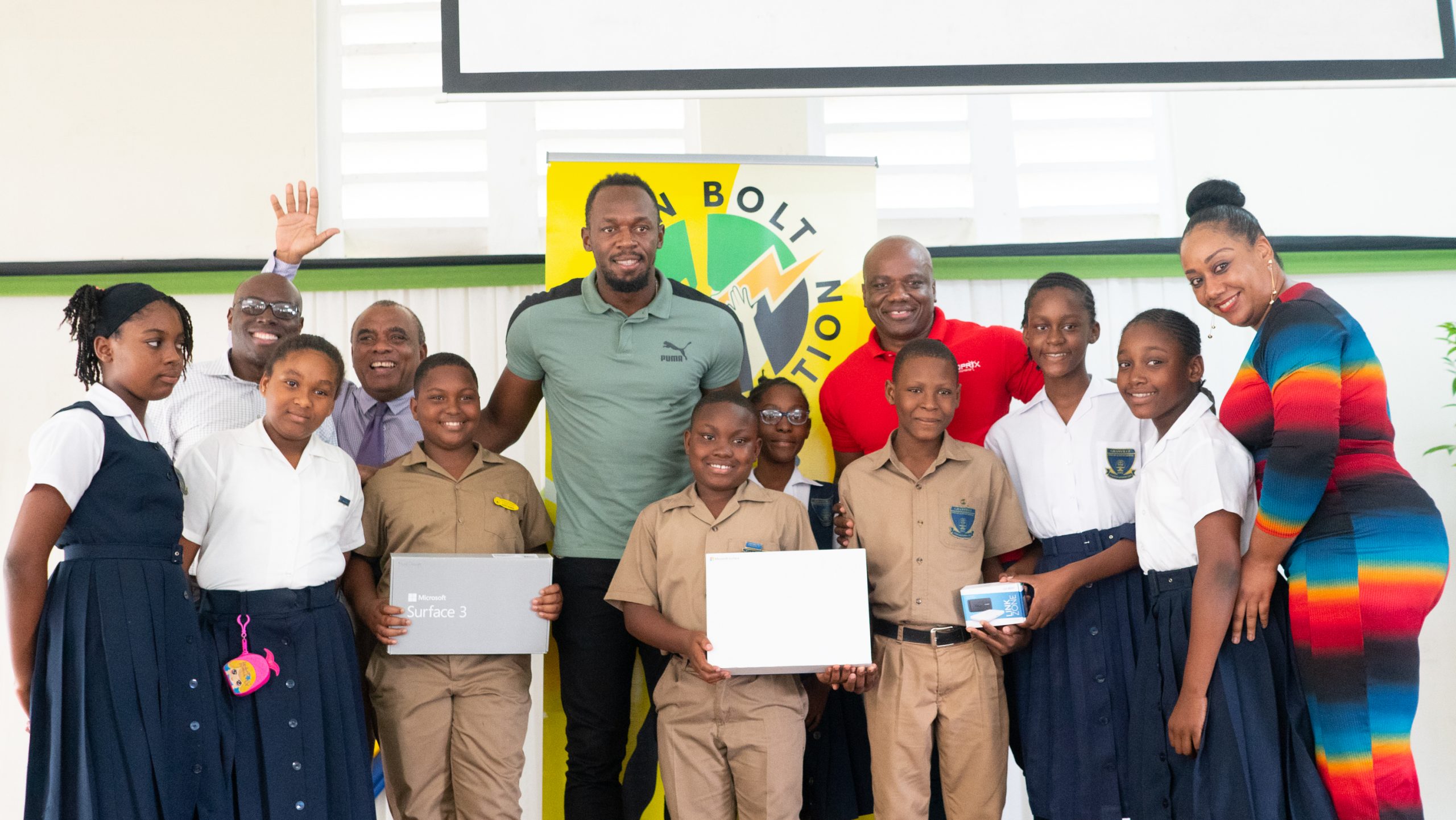 Usain Bolt Foundation refurbishes school ground and hands over computer