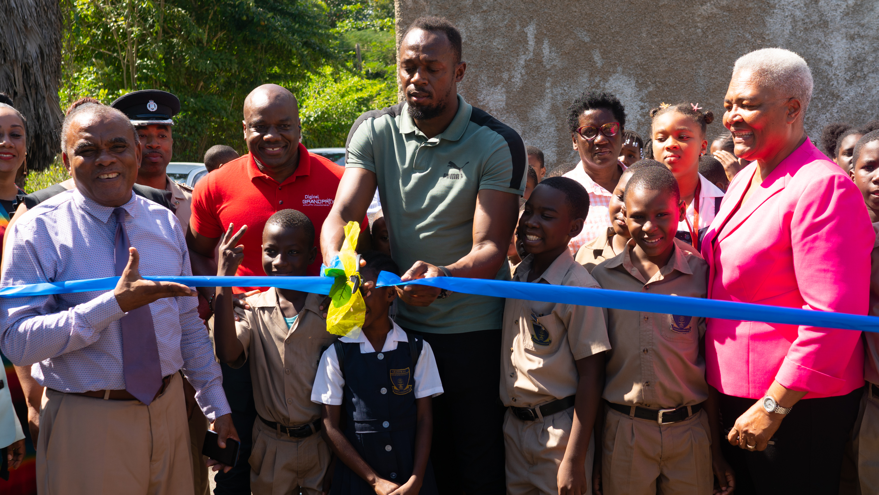 Usain Bolt Foundation refurbishes school ground and hands over computer