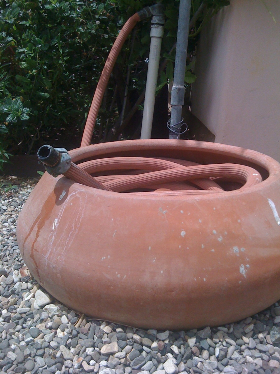 Conceal and Store Your Garden Hose in a Decorative Hose Pot Holder