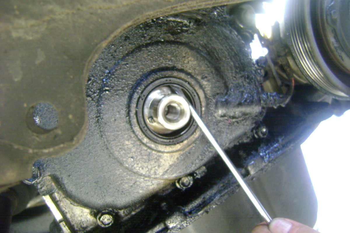 Replacing the Crankshaft Seal, Accessory Belt, and Tensioner Pulley on