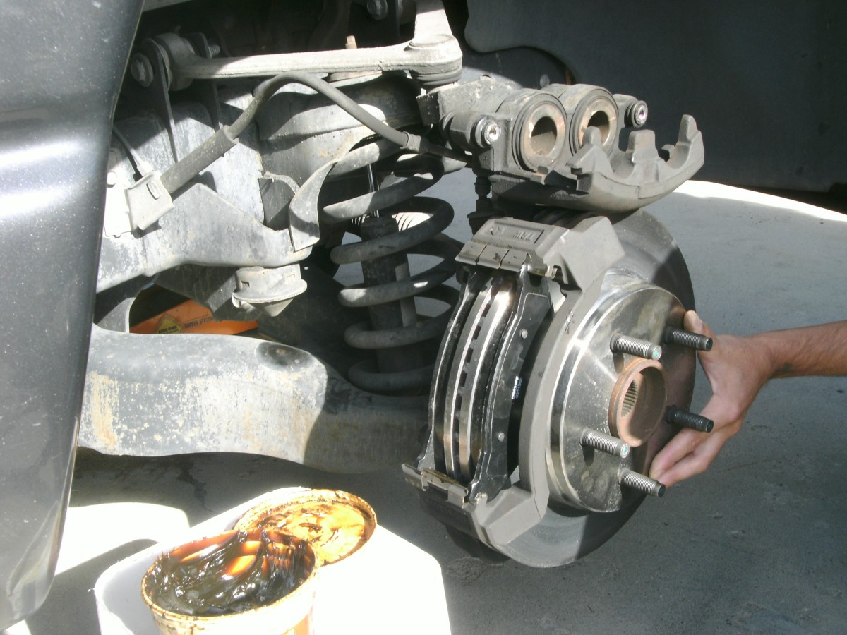 Dodge Ram 1500 How to Change Front Disc Brake Pads or Rotors AxleAddict