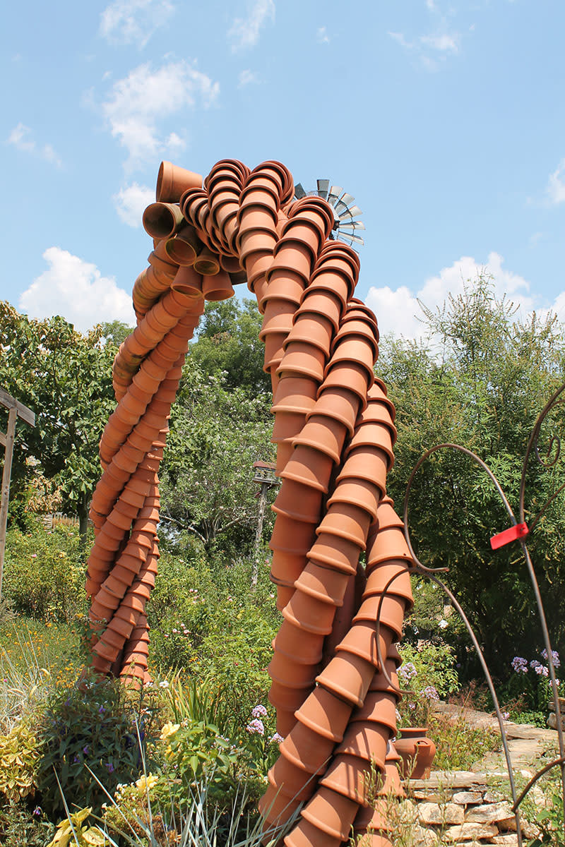 Wacky Creative Garden Art Blending junk and vintage items into