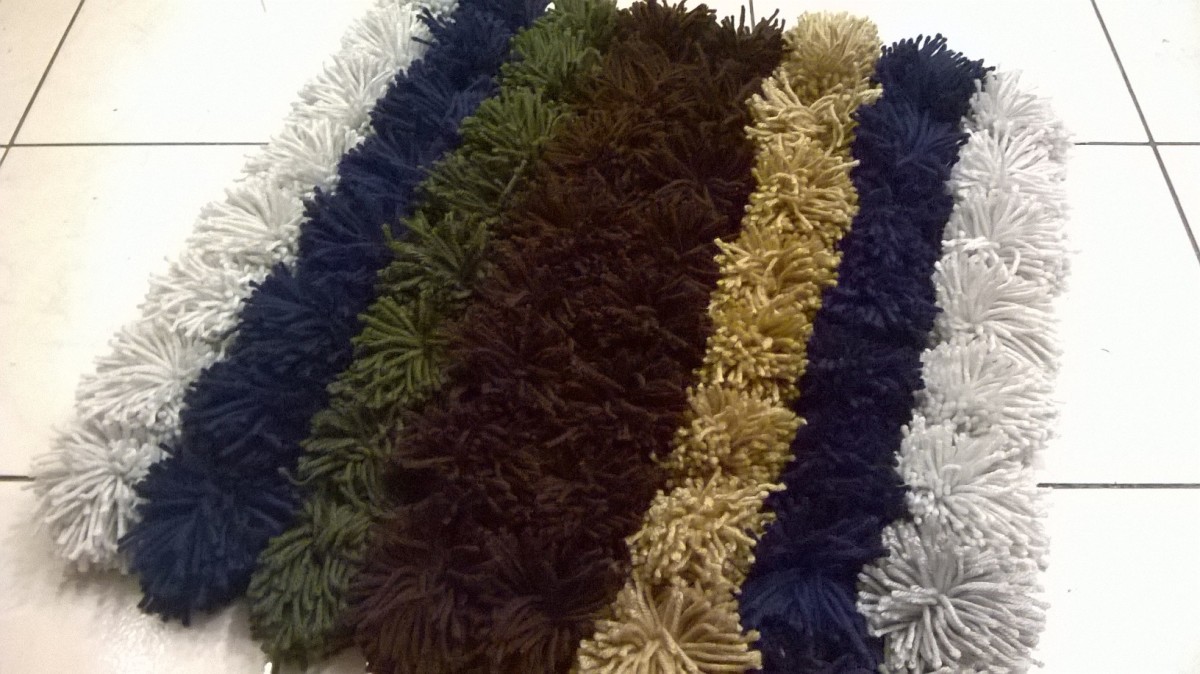 How to Make Your Own Yarn Pom Pom Rug