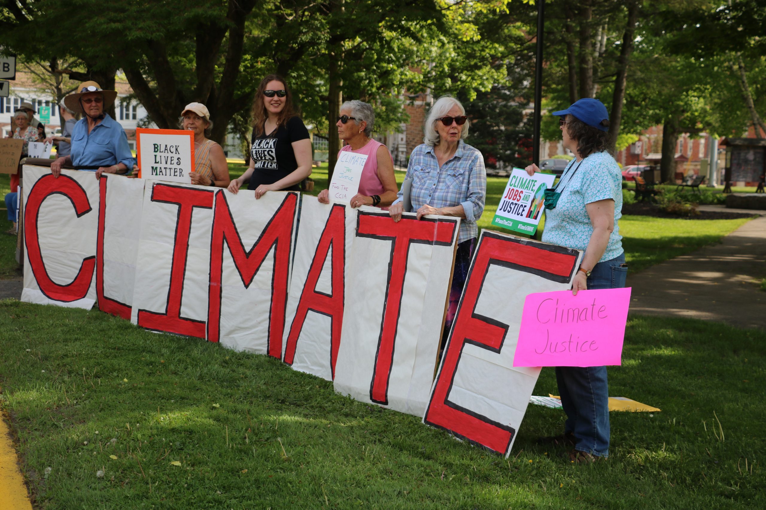 Crowd Rallies in Clinton for Passage of the Climate and Community