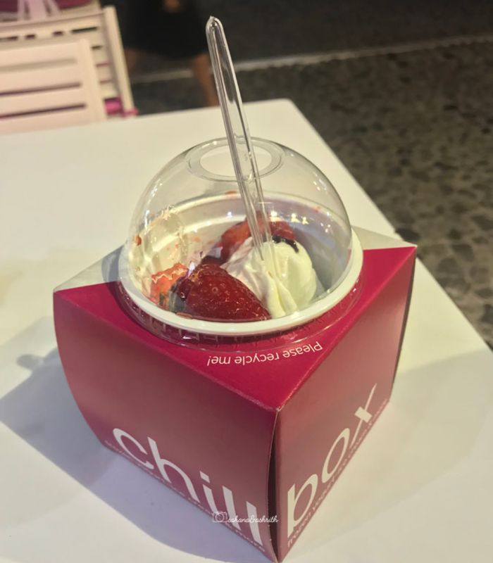 Pink paper box container with frozen yoghurt at Santorini