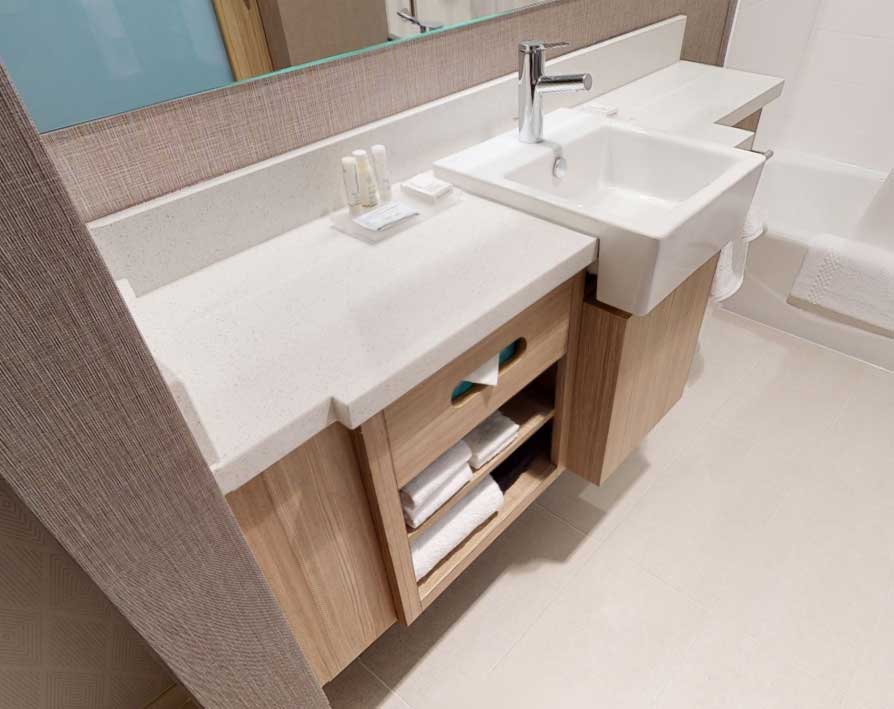 Beautiful, Custom Vanity Bases & Aprons for Hotel Bathrooms