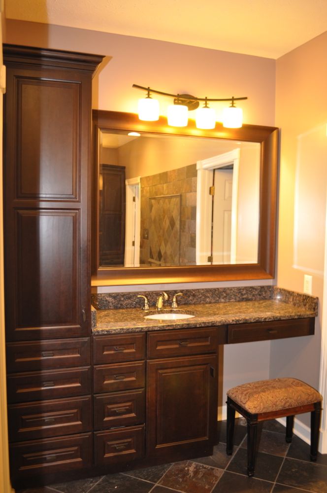 Cherry finish bathroom with granite countertop Vaughn