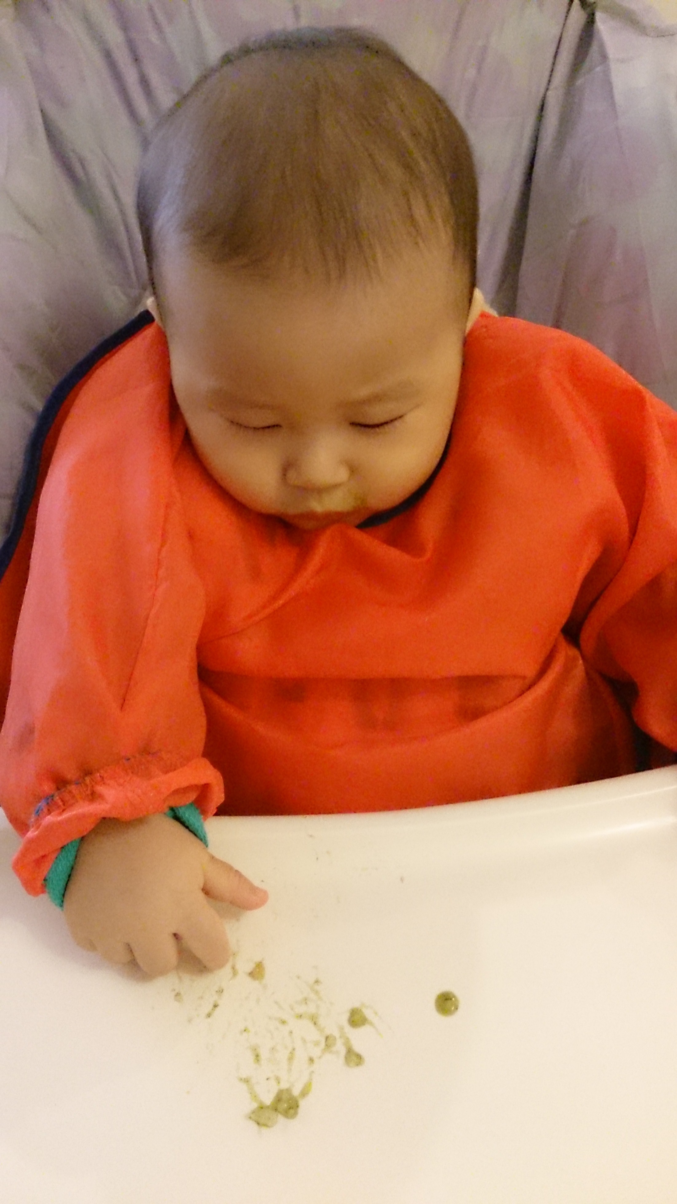 When do babies show their readiness for their first scribbling? Miss