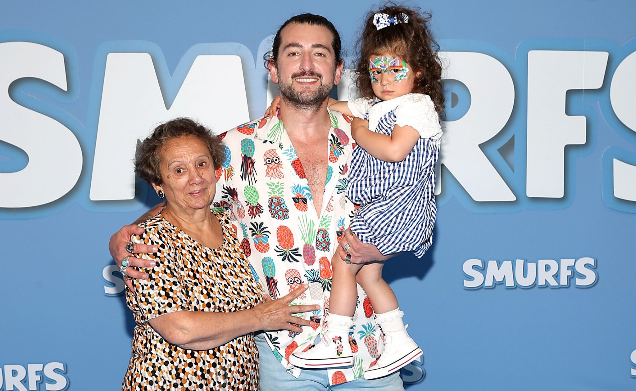 Arthur Gouroulian walks red carpet with his mother at Smurf screening