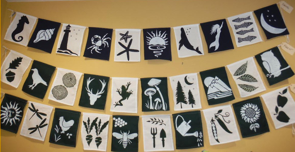 Printed string flags Visit Denman Island