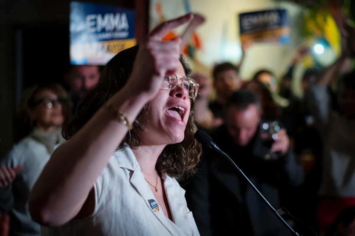 A woman speaking into a microphone.