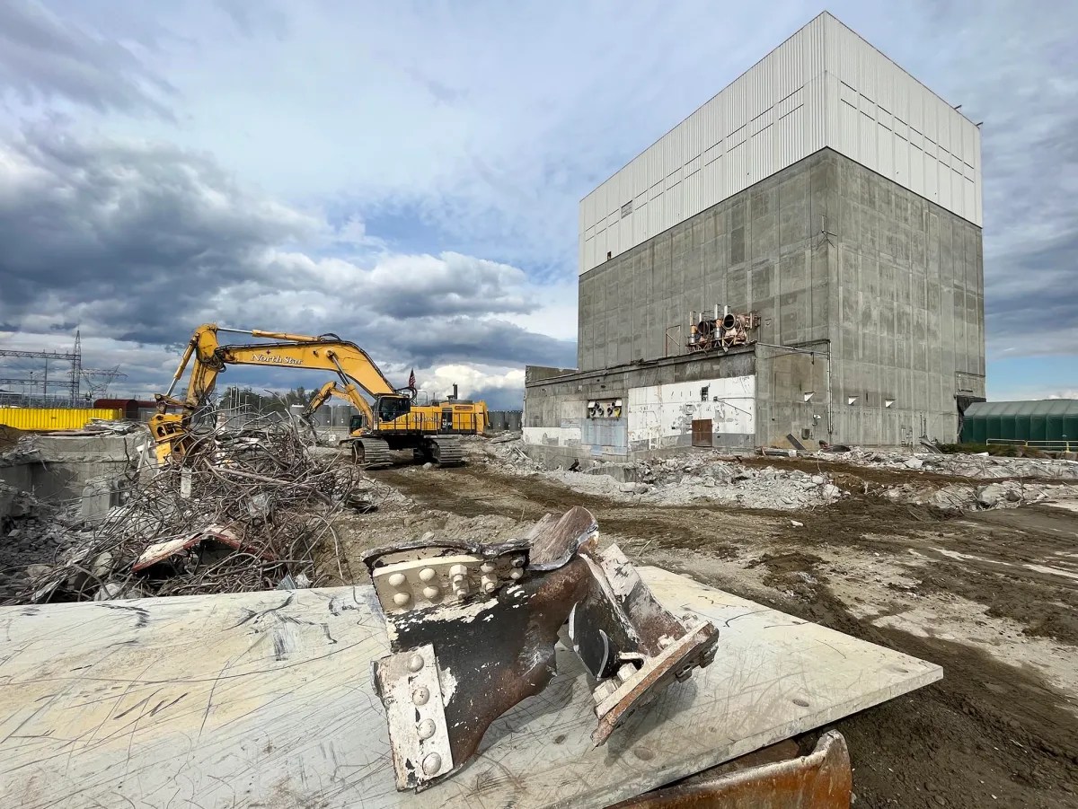 A construction site with an excavator and a bulldozer.