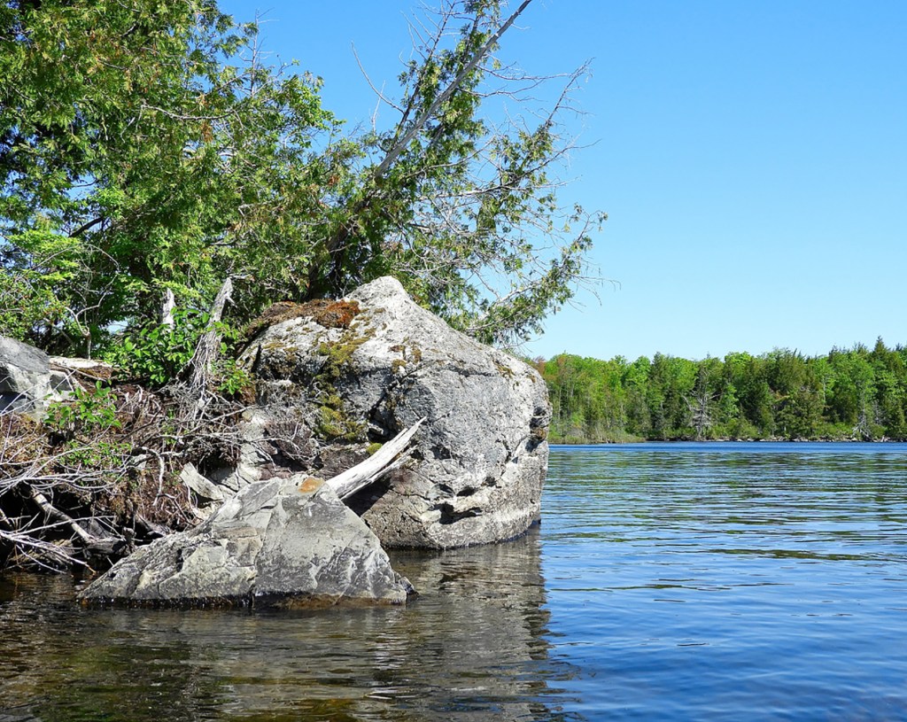 Canoeing in Maine Pleasant Lake in Stetson puts the perfect in a June day