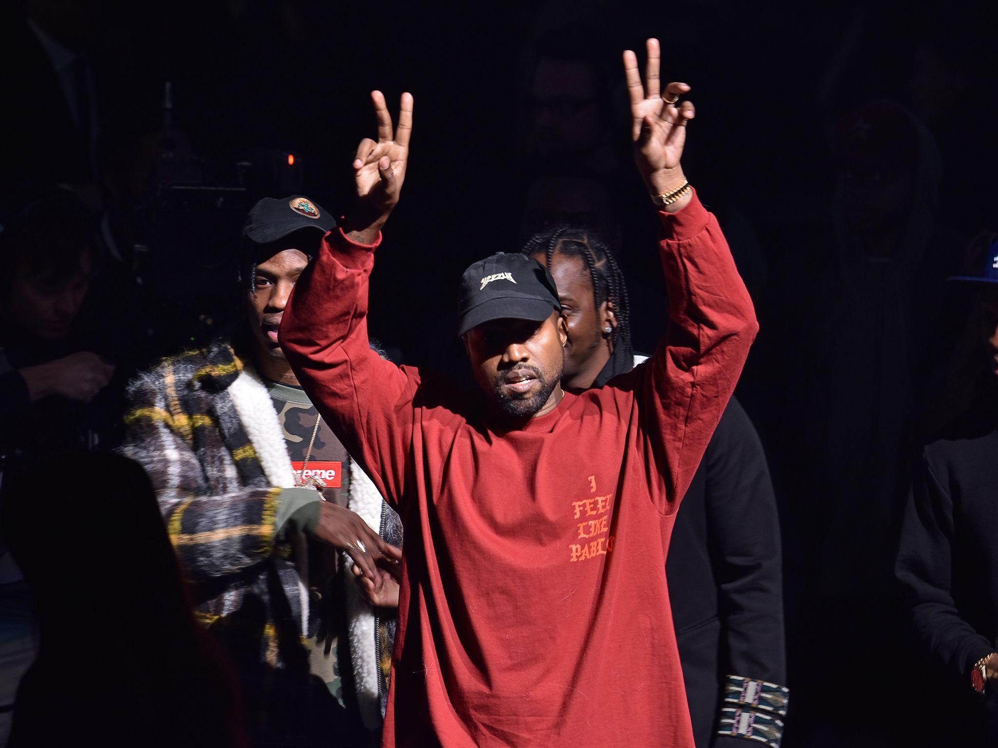 Kanye West Holding Hands Up Wallpaper